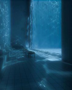 an underwater room with benches and tables in it