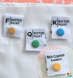 three different colored buttons on a white cloth with the words bottom right, bottom left and bottom right