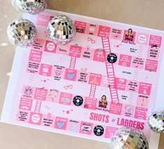 there are disco balls on top of the pink board with shots ladders written on it