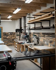 a workbench with many tools on it in a room that is being worked on