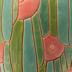 a close up view of a vase with many different designs on it's surface