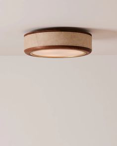 a round light fixture hanging from the ceiling