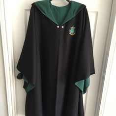 a harry potter robe hanging on a door