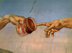 two hands reaching out to touch each other with food in front of the creation of man's hand