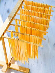 several pieces of pasta are drying on a rack