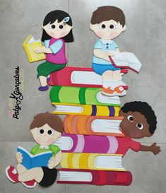 paper cutouts of children sitting on books