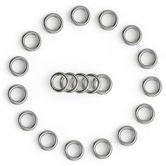 a group of rings arranged in the shape of an o - ring on a white background