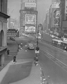 an old black and white photo of a city street