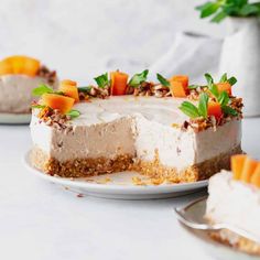 healthy no - bake carrot cheesecake on a plate with a slice cut out