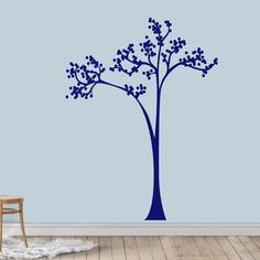 the blue tree wall decal is shown in an empty room