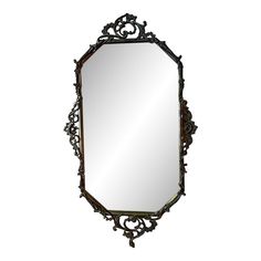 an ornate mirror is shown against a white background