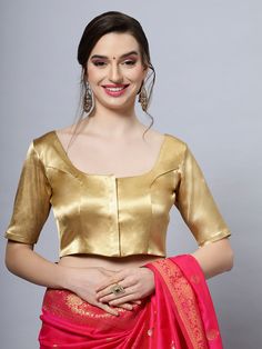 Item Type: Saree blouse / Crop top Product Features: Color: Gold Fabric: Cotton Satin Stretch Blend Trim: Back Tie Neck Style: Round, Front & Back Sleeve Length: Half Sleeves Closure: Front Hook Padded: No Occasion: Festivewear, Casual Product Type: Blouse Disclaimer: There will be slight difference in digital to actual image Festive Short-sleeve Blouse Piece, Fitted Short Sleeve Festive Tops, Fitted Short Sleeve Tops For Festive Occasions, Festive Short Sleeve Padded Blouse, Festive Fitted Short Sleeve Tops, Fitted Gold Padded Blouse, Fitted Gold Blouse Piece With Short Sleeves, Gold Long Sleeve Top For Wedding, Gold Long Sleeve Wedding Top