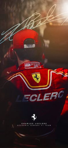 the back of a man wearing a red and yellow racing uniform with autographs on it