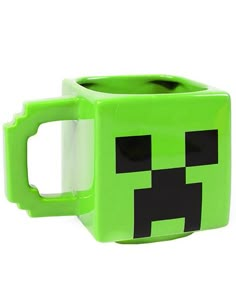 a green minecraft mug with a black face on it