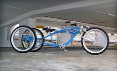 a blue bicycle parked in an empty parking garage