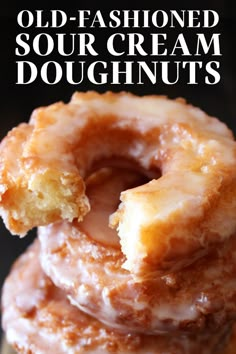 three donuts stacked on top of each other with the words old - fashioned sour cream doughnuts