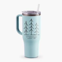 a blue cup with a straw in it and trees on the side that says forest