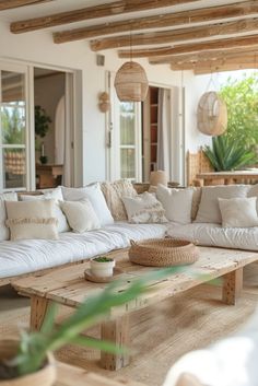 a living room filled with lots of white furniture