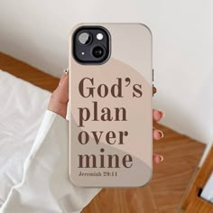 a person holding up a phone case with the words god's plan over mine