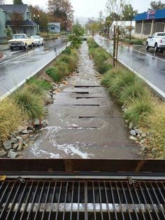 the water is running down the side of the road