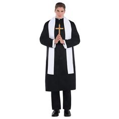 a man wearing a priest's robe and standing with his hands folded in front of him