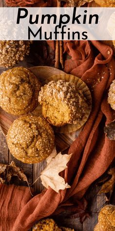 pumpkin muffins on a wooden table with autumn leaves