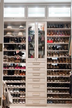 the closet is full of shoes and hats