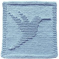 a blue knitted square with the shape of a bird