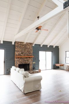 a living room with a couch and fireplace in it