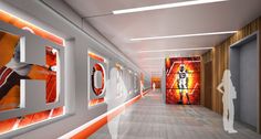 the hallway is decorated with orange and white art on the walls, along with a woman standing in front of an open door