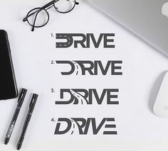 the words drive and drive are written in black on a white paper next to a computer