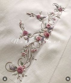 the embroidery on this dress is very pretty and has pink flowers in it's center