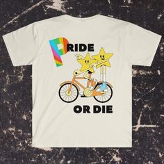 Beige Shirt with two star characters riding a bike together with the words "Pride or Die" Pride Shirts Funny, Pride Shirt Ideas, Pride Outfit Ideas, Being True To Yourself, Pride T Shirt, Pride Tees, Riding A Bike, True To Yourself, Star Character