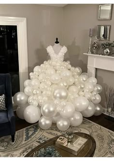 a dress made out of balloons in a living room