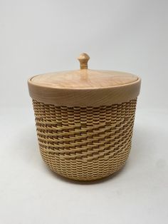 a wooden lid on a wicker basket