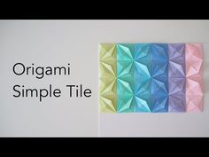 an origami wall hanging with the words origami simple tile