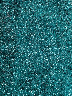 an aerial view of blue glitter on the ground