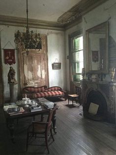 a living room filled with furniture and a fire place