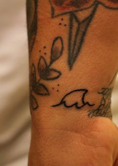 a person with a tattoo on their arm