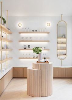 the inside of a store with wooden shelves