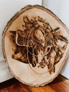 a piece of wood with an image of a horse on it's back side