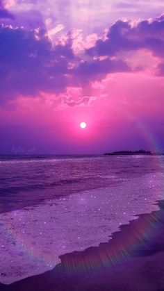 the sun is setting over the ocean with purple clouds