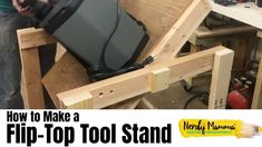 a man standing next to a wooden table with a laptop on it and the words how to make a flip top tool stand