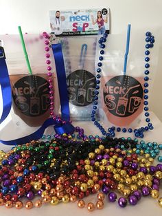 some beads are laying on the table next to each other and two bags with them