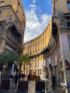 people are walking around in an old city