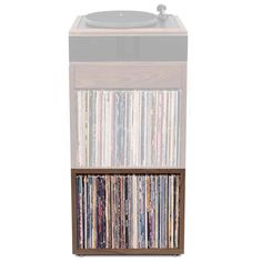 an old record player with many records on it's sides and a shelf full of cds