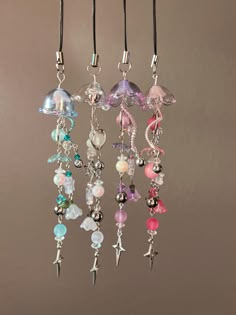 a bunch of different colored beads hanging from a hook