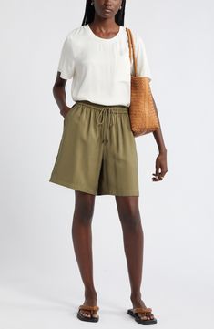 Slip into the casual ease of loose-fitting shorts topped with a comfortably customizable drawstring waist. Elastic/drawstring waist 91% viscose, 9% polyester Machine wash, line dry Imported Relaxed Fit Viscose Bottoms For Vacation, Chic Relaxed Fit Bermuda Shorts With Elastic Waistband, Casual Bottoms With Drawstring Tie For Summer, Casual Summer Bottoms With Drawstring Tie, Chic Bermuda Shorts With Elastic Waistband And Relaxed Fit, Spring Vacation Shorts With Functional Drawstring, Casual Viscose Bottoms With Pockets, Casual Bottoms With Drawstring Tie, Functional Drawstring Shorts For Vacation In Spring