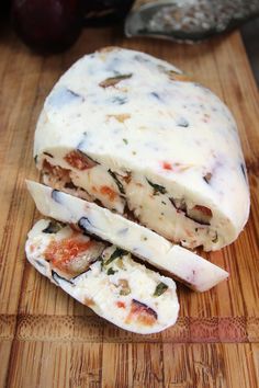 the cheese has been cut into pieces and is ready to be eaten on the cutting board