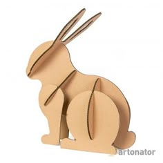 a wooden cutout of a rabbit sitting on its hind legs